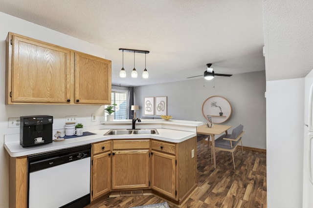 kitchen featuring kitchen peninsula, decorative light fixtures, dishwasher, a textured ceiling, and sink