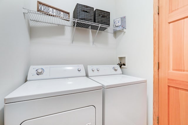 laundry area with independent washer and dryer