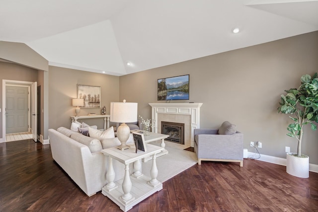 living room with lofted ceiling and dark hardwood / wood-style flooring