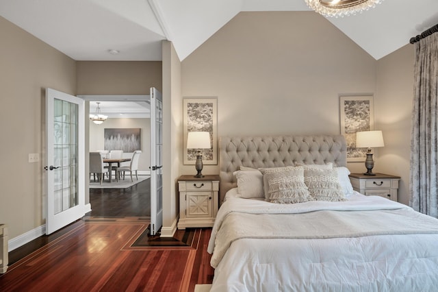 bedroom featuring high vaulted ceiling and dark hardwood / wood-style flooring