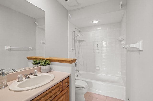 full bathroom with vanity, tiled shower / bath combo, toilet, and tile patterned floors