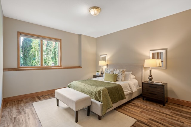 bedroom with wood-type flooring