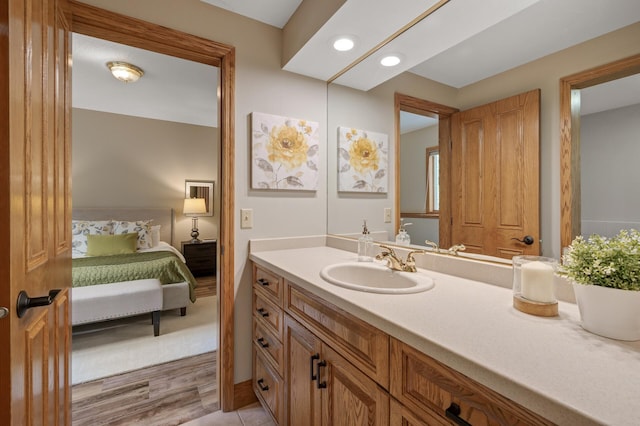 bathroom featuring vanity and hardwood / wood-style floors