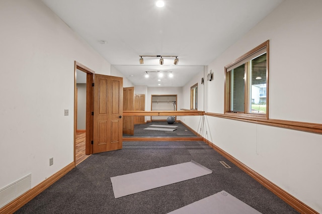 hall with carpet floors