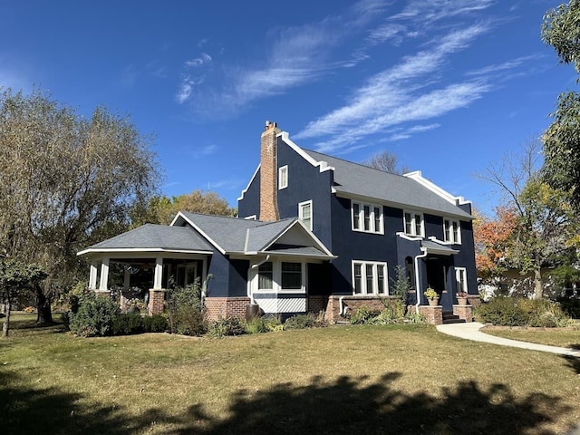 view of front of home featuring a front yard and covered porch