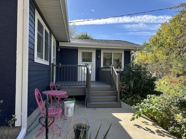 entrance to property featuring a wooden deck