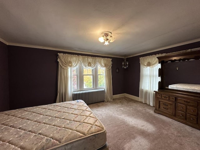 bedroom with carpet, crown molding, and radiator heating unit