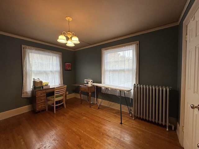 office featuring wood-type flooring, radiator, a notable chandelier, and ornamental molding