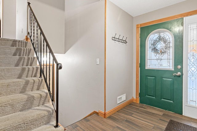 entrance foyer with dark hardwood / wood-style flooring