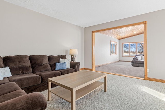 carpeted living room with lofted ceiling and wooden ceiling