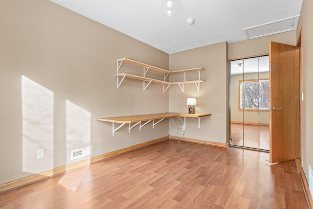 unfurnished living room featuring light hardwood / wood-style floors