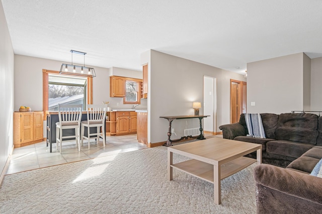 carpeted living room with a textured ceiling