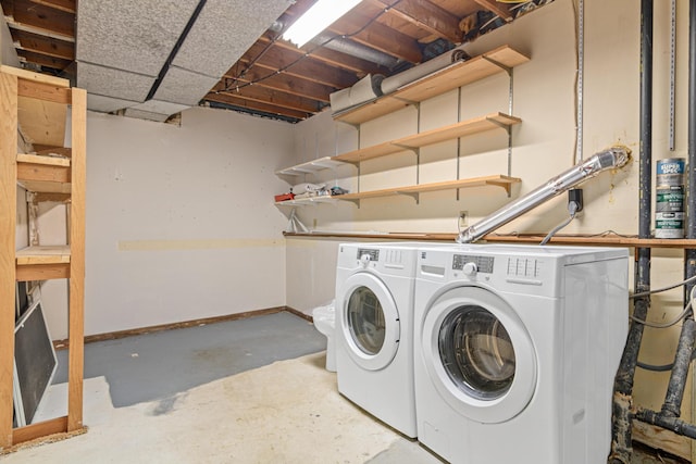 washroom featuring washing machine and dryer