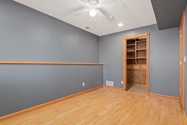 unfurnished bedroom featuring ceiling fan and light wood-type flooring