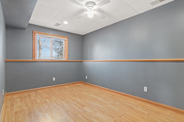 empty room featuring light hardwood / wood-style flooring and ceiling fan