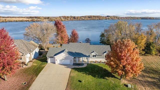 birds eye view of property with a water view