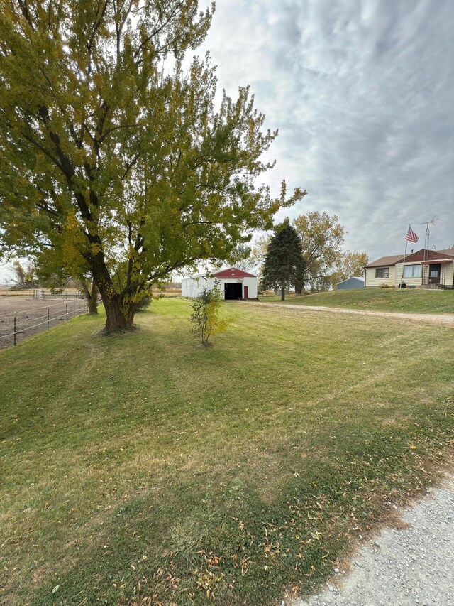 3234 14th Ave, Owatonna, MN 55060 - view of yard with a pole building, a garage, and an outdoor structure
