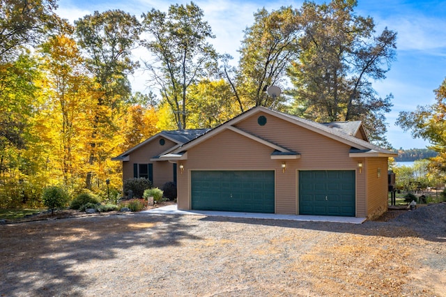 view of front of home featuring driveway and a garage