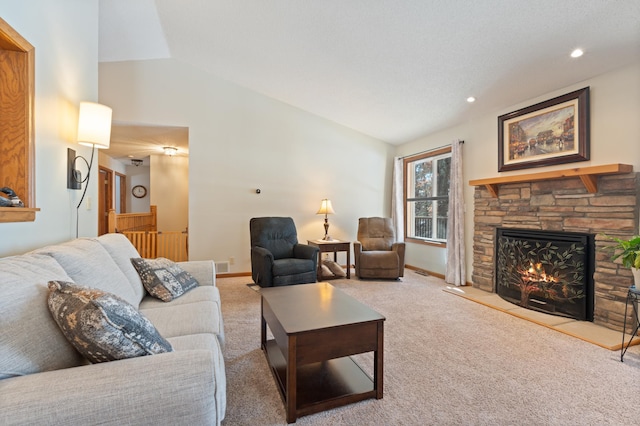 living area featuring baseboards, light colored carpet, vaulted ceiling, a stone fireplace, and recessed lighting