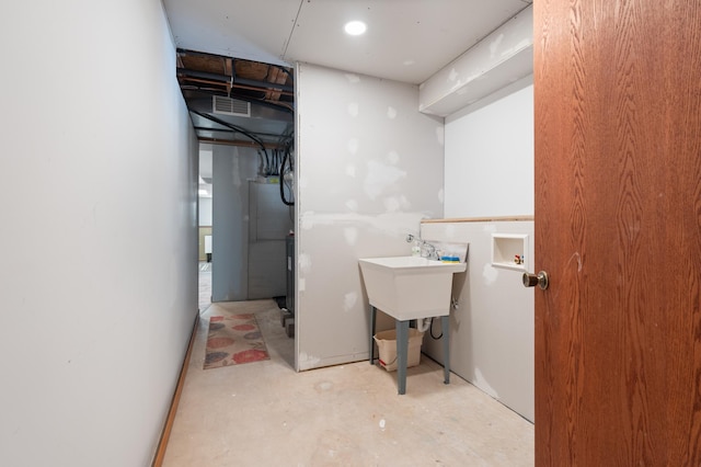 interior space with laundry area and visible vents