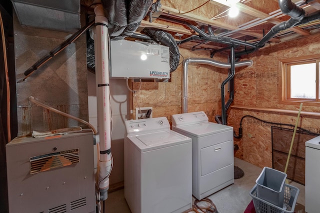 clothes washing area featuring washer and dryer