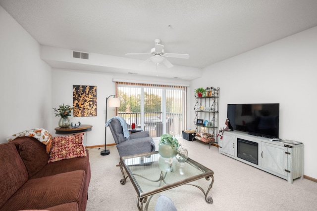 living room featuring carpet floors and ceiling fan