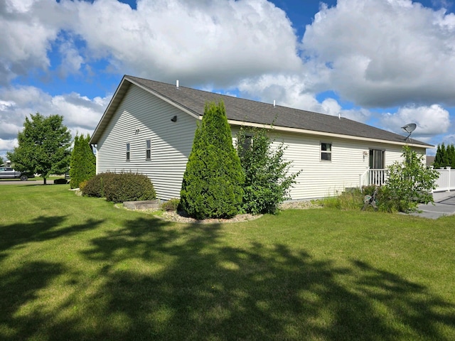 view of property exterior featuring a yard