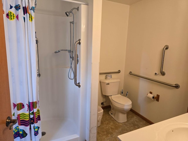 bathroom with tile patterned floors, sink, a shower with curtain, and toilet