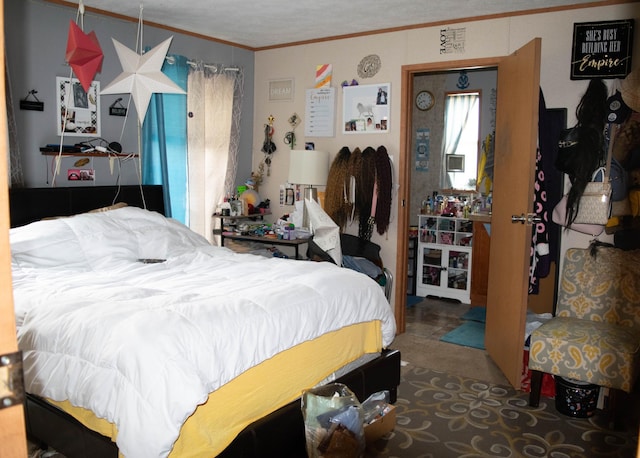 carpeted bedroom featuring crown molding