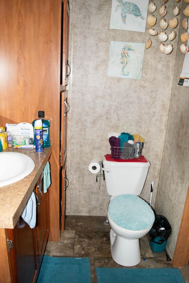 bathroom featuring toilet and vanity