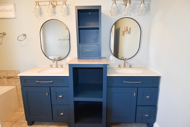 bathroom featuring tile patterned flooring, vanity, and a bathtub