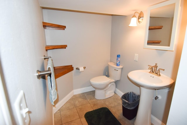 bathroom featuring tile patterned flooring and toilet