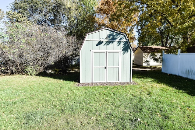 view of outbuilding featuring a yard