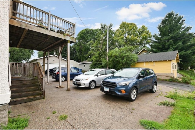 view of car parking with a garage