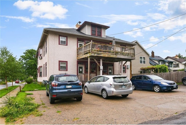 view of front of property with a balcony