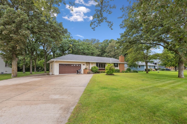 141 Lakeshore Dr, Big Lake, MN 55309 - view of front facade featuring an attached garage, a chimney, concrete driveway, a front lawn, and stucco siding