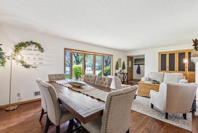 141 Lakeshore Dr, Big Lake, MN 55309 - dining room with a textured ceiling, dark wood-style floors, and baseboards