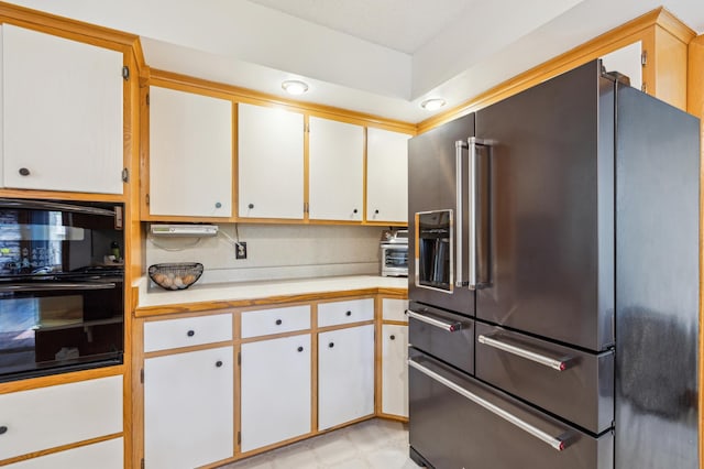 141 Lakeshore Dr, Big Lake, MN 55309 - kitchen featuring high quality fridge, black oven, light countertops, and wall oven