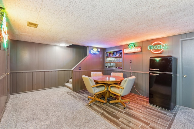 141 Lakeshore Dr, Big Lake, MN 55309 - dining room featuring stairway, wood finished floors, and wood walls