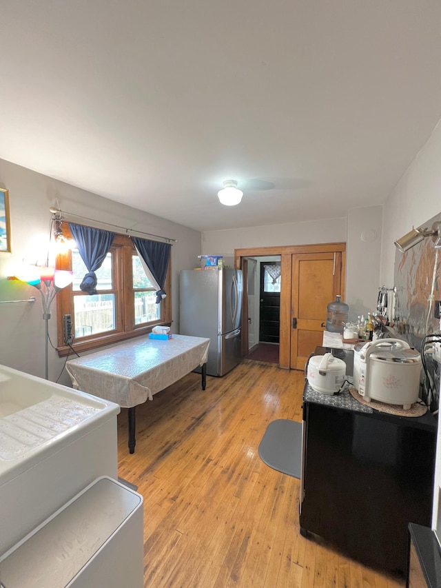 interior space with stainless steel refrigerator and light wood-type flooring