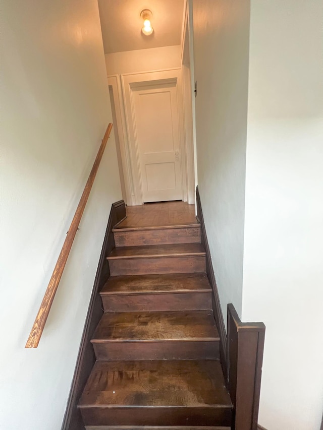 stairway featuring hardwood / wood-style floors