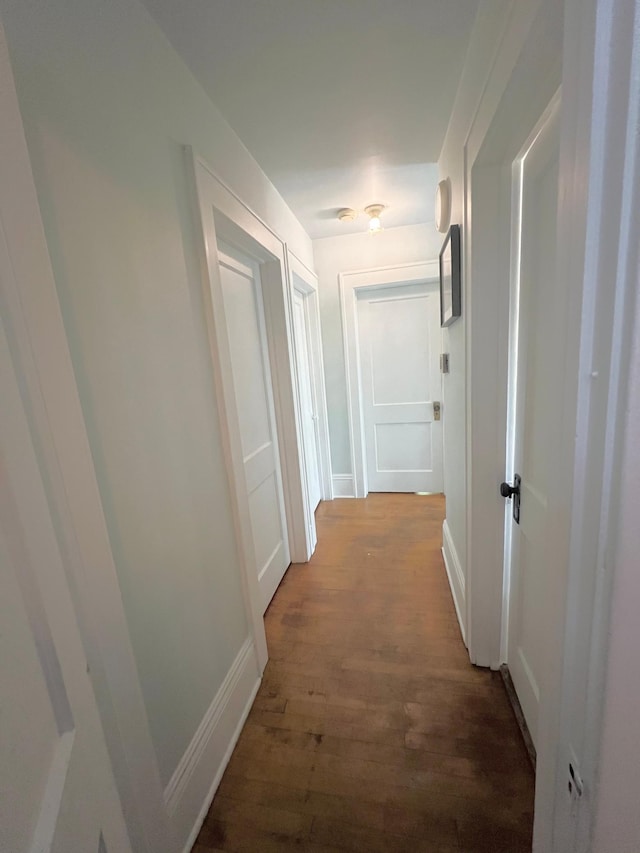 corridor featuring hardwood / wood-style floors