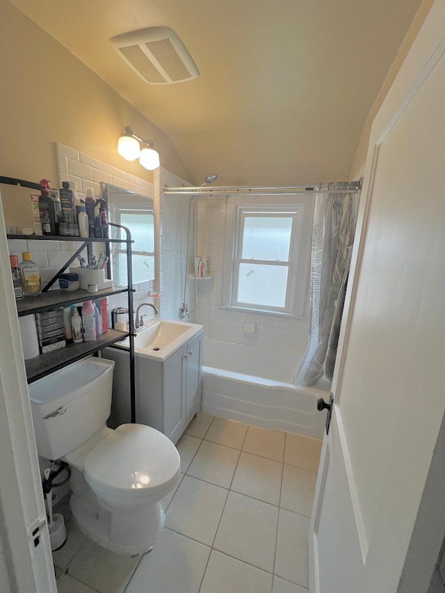 full bathroom with shower / bath combo, toilet, lofted ceiling, vanity, and tile patterned flooring