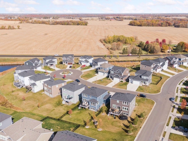 bird's eye view featuring a water view and a residential view