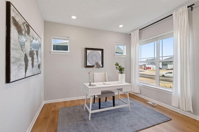 office with recessed lighting, wood finished floors, visible vents, and baseboards