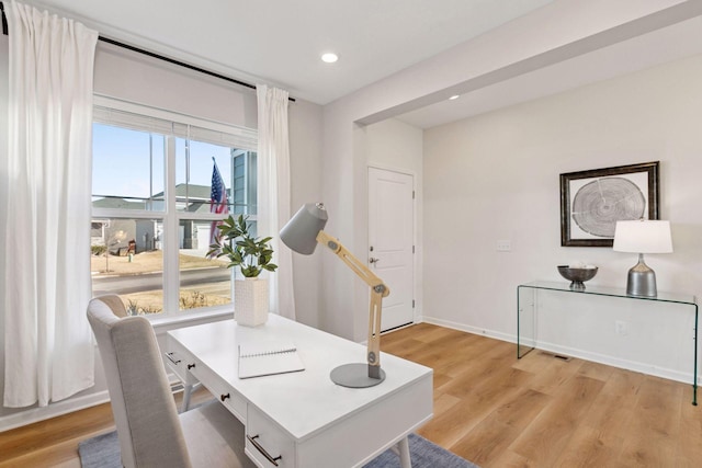 office area featuring recessed lighting, light wood-type flooring, and baseboards