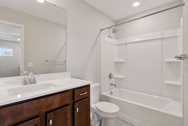 bathroom featuring toilet, recessed lighting, tub / shower combination, and vanity