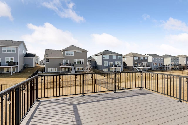 wooden terrace featuring a residential view