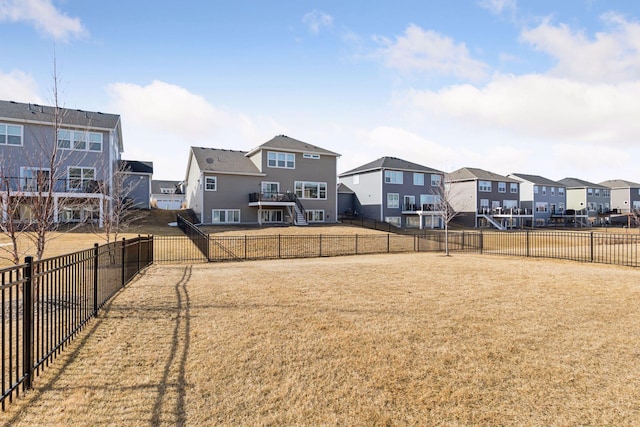 view of yard with a residential view and fence