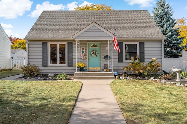 bungalow-style home with a front lawn